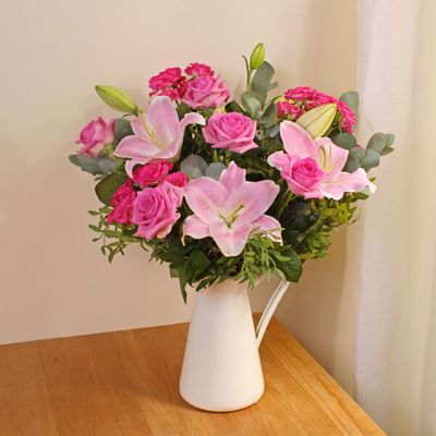 Our Mum's Delight bouquet features an elegant display of lilies and roses, and is the perfect way to express your emotions in style. Pink flowers are perfect for sending that someone special a beautiful message of love and our same day delivery make these the ideal last minute Mother's Day flowers. This bouquet will be handcrafted by an experienced florist, and delivered by hand. Please note vase not included but can be added at checkout. 