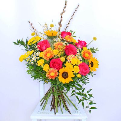 Each bouquet is a unique creation, handcrafted by our artisanal local florists and features a delightful combination of Sunflowers and Roses. Tell someone how special they are, and send them something of equal individuality. This bouquet will be handcrafted by an experienced florist, and delivered by hand.