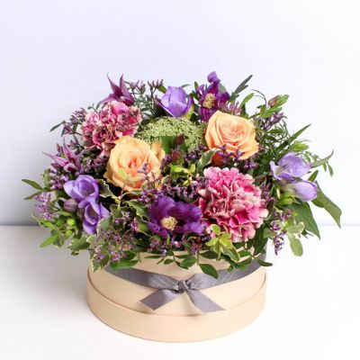 Rich in lavender, orange and pink colour tones, our Jewel Tone Hatbox is a combination of Freesias, Carnation and Roses. Beautiful and elegant, these fresh, hand tied flowers are perfect for any occassion.