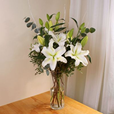 A simple and clean bouquet, these hand cut blooms are a prime example of seasonal flowers. Our white lilies are the best quality, and picked to last.