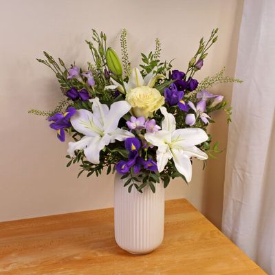 A wonderful gift for any occasion, this handcrafted bouquet of subtle white and purple blooms will provide delight and joy to all those who receive it. This bouquet will be handcrafted by an experienced florist, and delivered by hand.